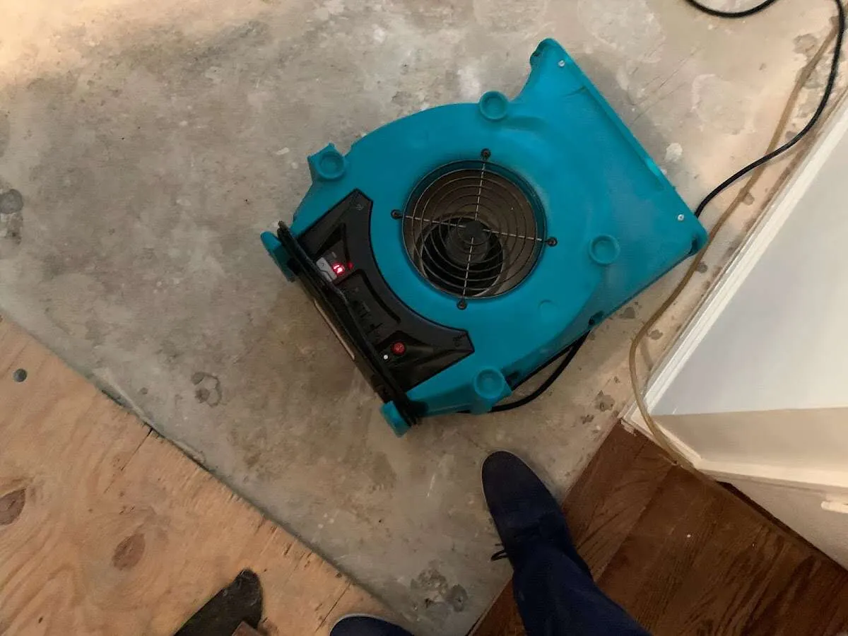 Air mover drying subfloor during Leak Detection & Repair in Pensacola